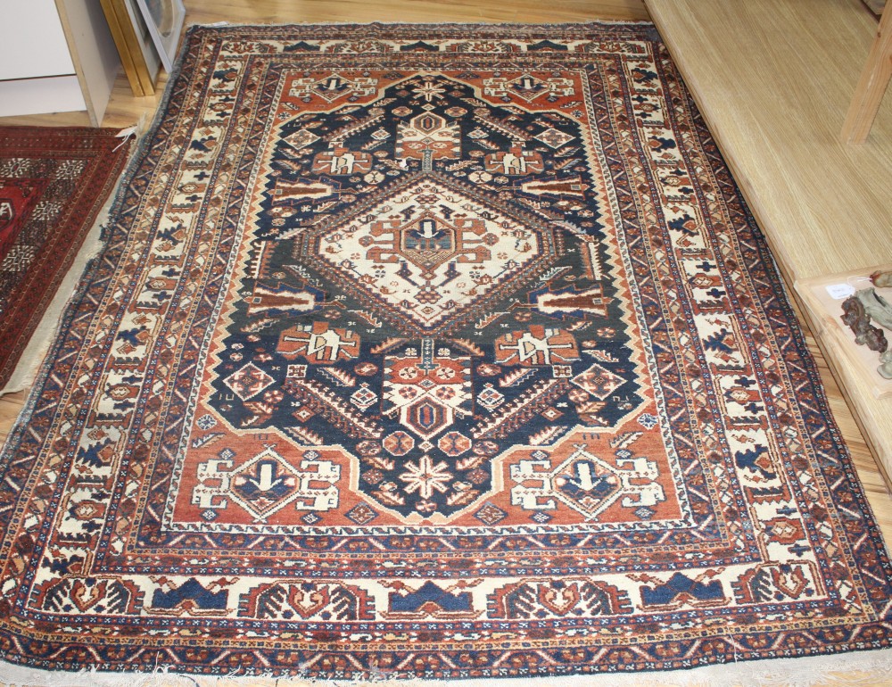 A Caucasian blue ground rug, 212 x 150cm